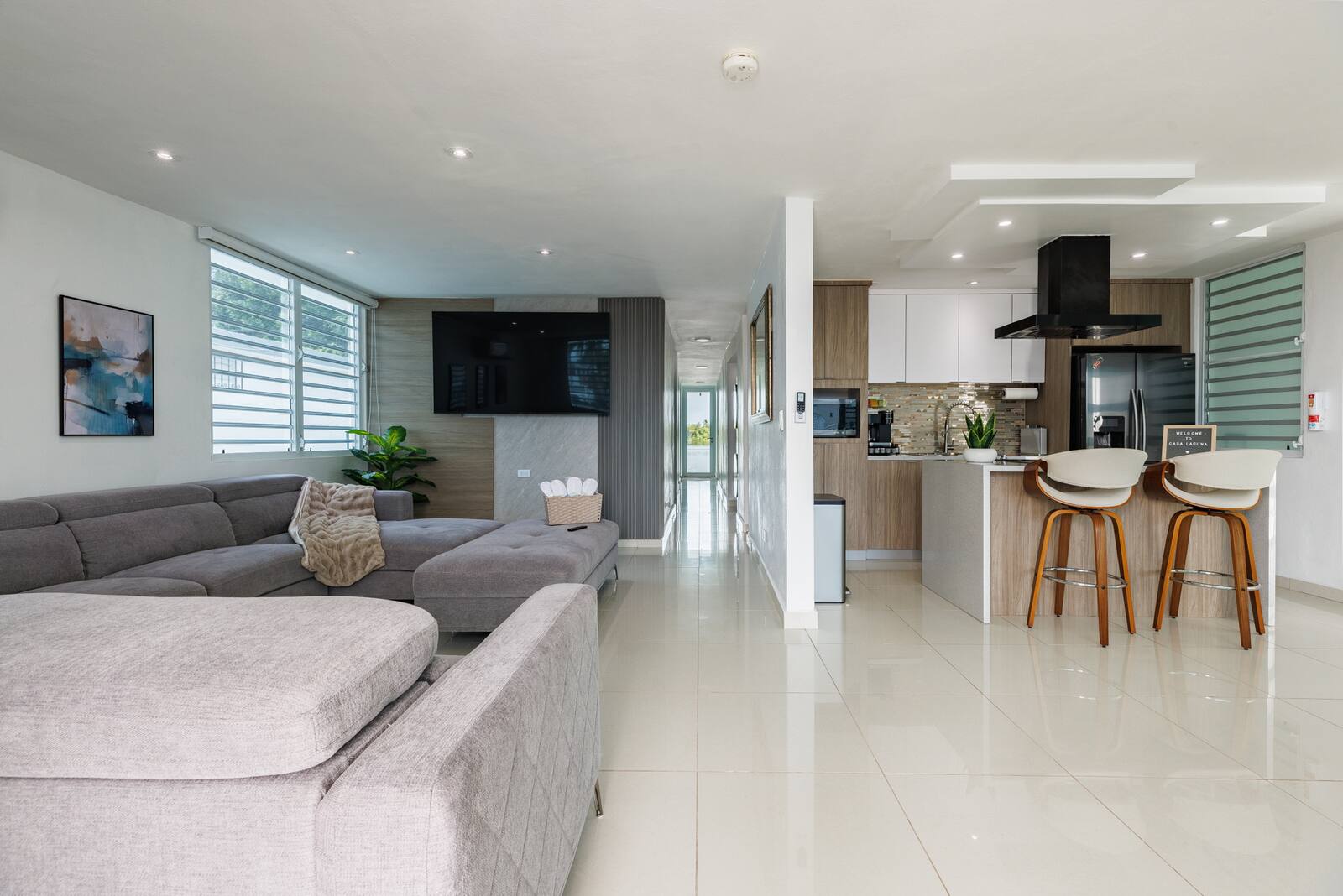 Living room and kitchen with the hallway out to the backyard